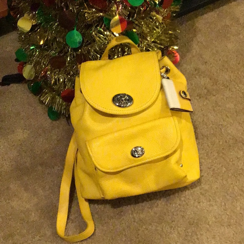 Small coach mustard color backpack